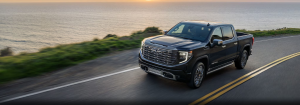 2024 GMC Sierra 1500 driving by the ocean