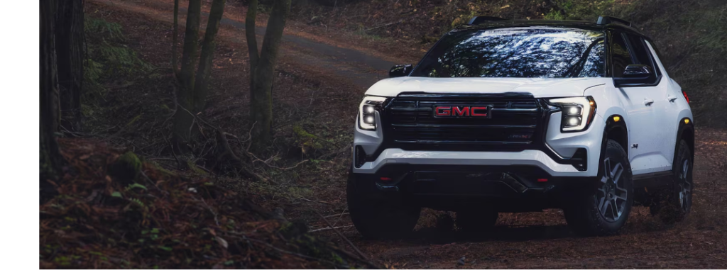 2026 GMC Terrain driving in the woods