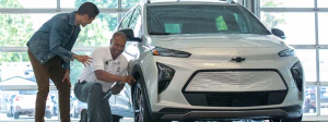 Two men installing official GM parts