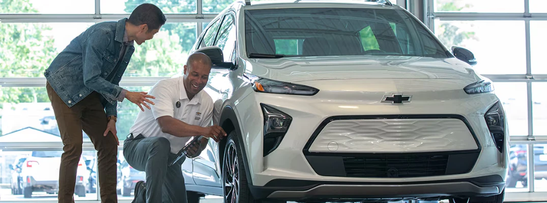Two men installing official GM parts